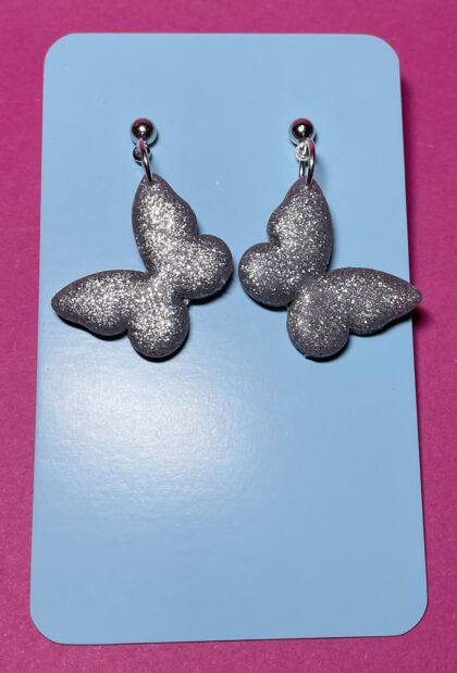 Mariposas hermosas grises purpurina
